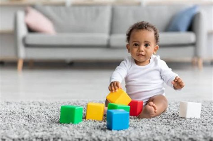 At what age do babies sit up?
