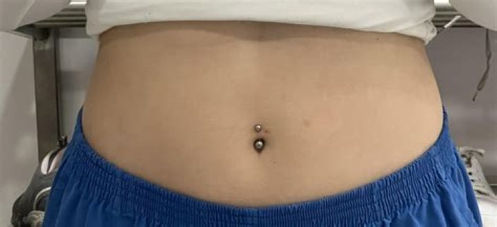 Can I take a bath with a fresh belly piercing?