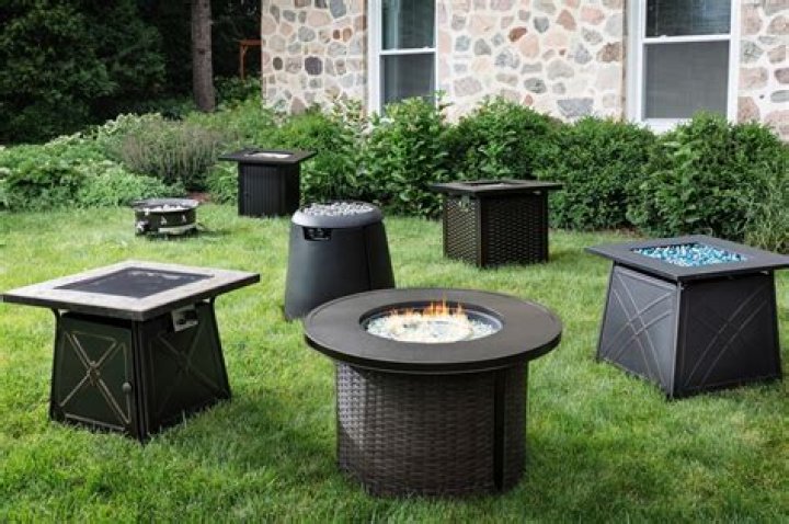 Can you burn wood in a propane fire pit?