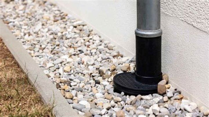 Can you cover a French drain with dirt?