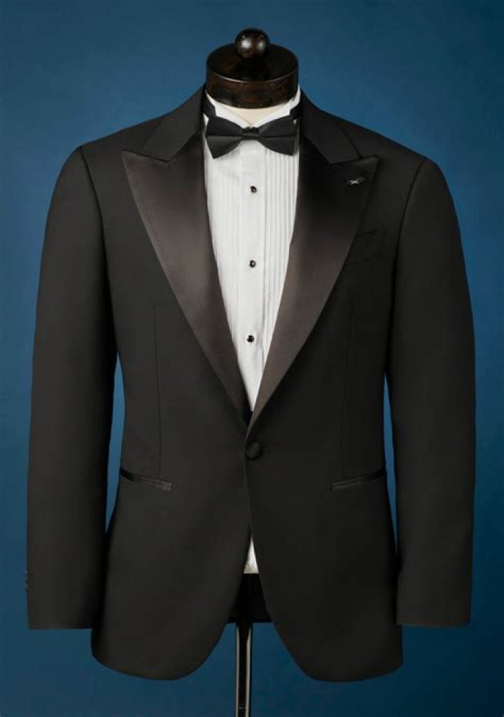 Do you button a tuxedo jacket with a vest?
