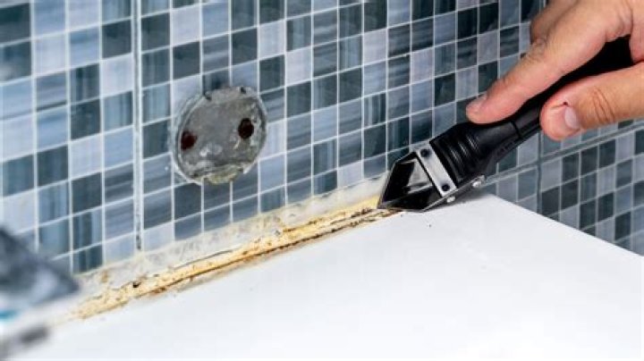 How do you smooth caulk after it dries?