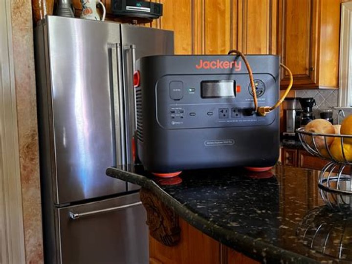 How many batteries and solar panels do I need to run a refrigerator?