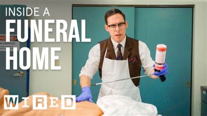 Is it okay to touch a body at a funeral?