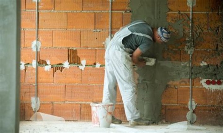 Is stucco over brick a good idea?