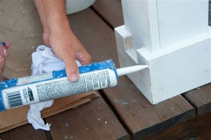 Should you caulk trim before or after painting?