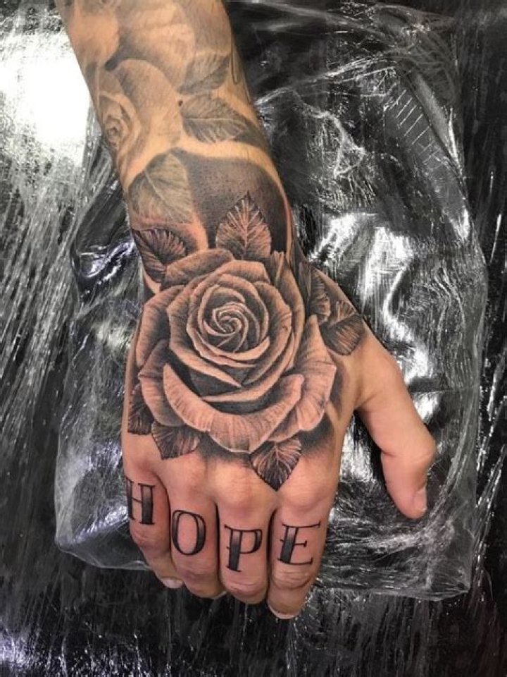 What does a rose tattoo on your hand mean?