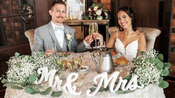 Who sits with bride and groom at rehearsal dinner?