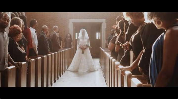 Who walks with the groom down the aisle?
