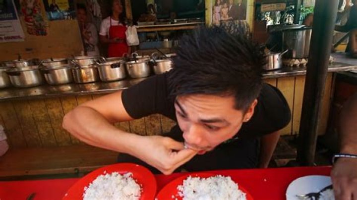 Why do Filipinos eat with their hands?