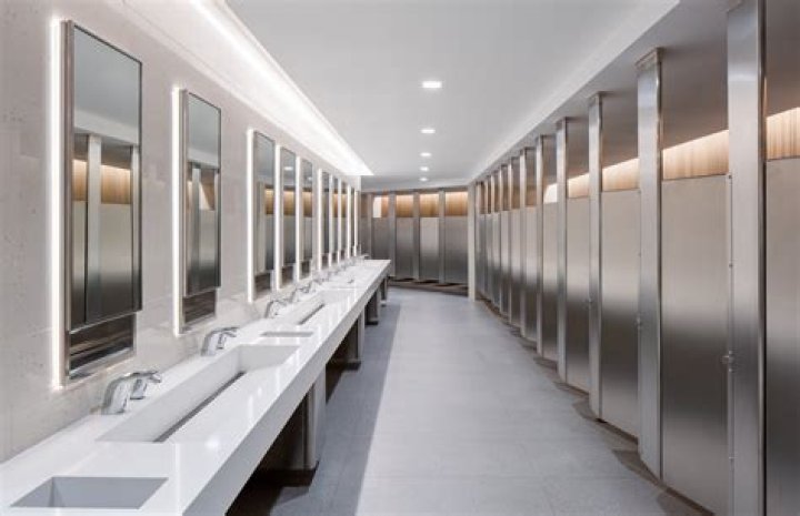 Why do men's restrooms not have stalls?