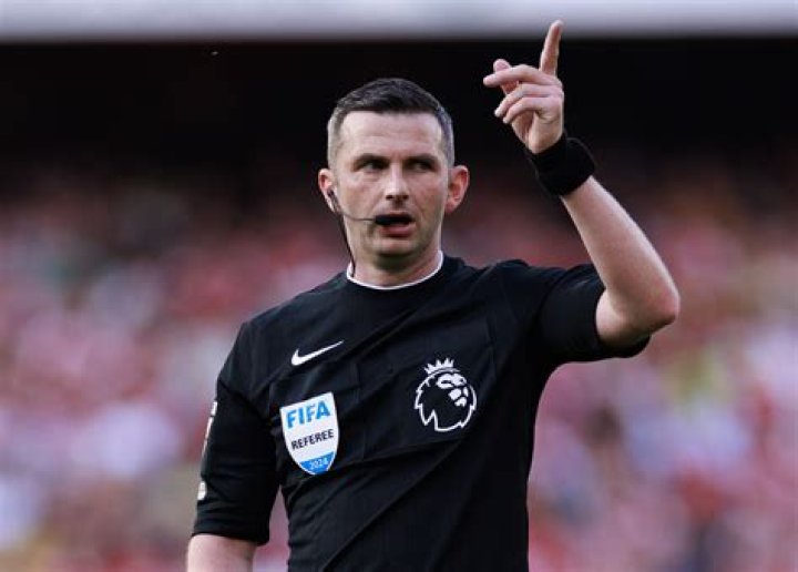 Why do refs wear black gloves?