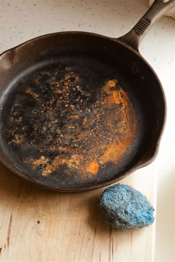 Why does my cast iron skillet rust after each use?