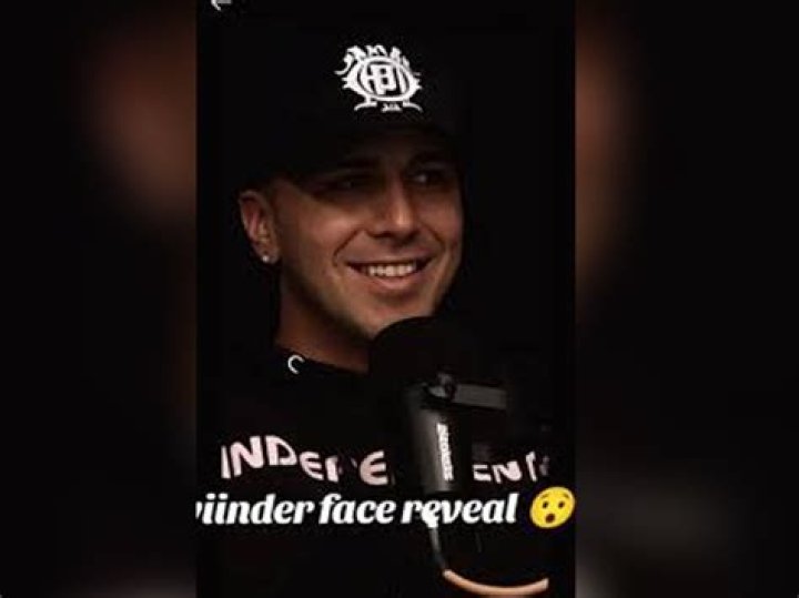 Why does my cat hide his face in my arm?
